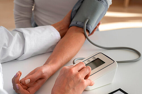 Medic taking a patient's blood pressure