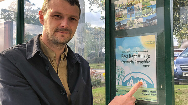 Councillor Alec Sandiford next to the Fulford noticeboard